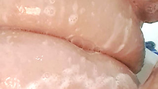 53 year old milf, tits and pussy covered in cream, wet in the shower