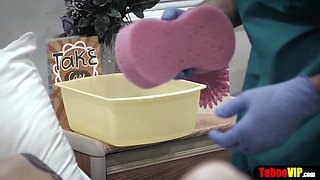 Doctor gives patient a sponge bath and vaginal probe