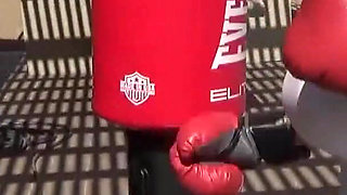 Smoking outdoor with the boxing muscled lady