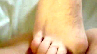 A Guy Does a Footjob for Me