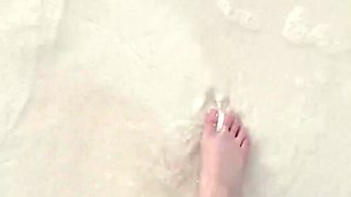 Running my bare feet on the white beach sand by the ocean.
