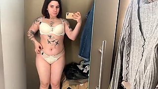 Sheer and mesh clothing tries on sexy tattooed alternative model