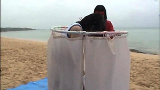 Bodacious Japanese slut gets used by two guys on the beach