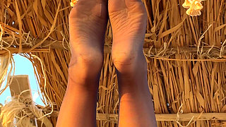 The Best View on the Beach Is Not the Sea, but My Feet in Black Tights Hanging Over Your Head
