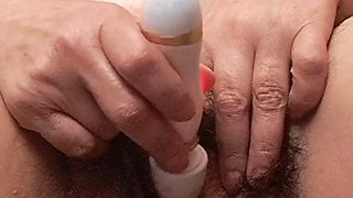 Masturbating with Vibrator on Mature Clitoris