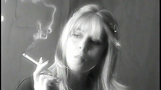 Lovely blonde smokes seductively