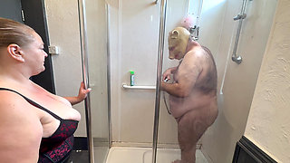 Domina Satana and Satana's piggy in the shower.