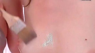 Girls Covering Bodies with Oiled Brush and Scissoring