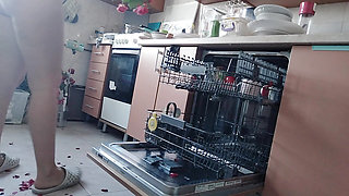 Sexy nude wife preparing food in the kitchen. Hairy brown hair, big ass, big tits.