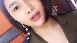 Chinese girl dressed in uniform showing breasts