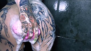 Sexy tattoed slut gets horny after hot shower and masturbates on her bed with her big dildo