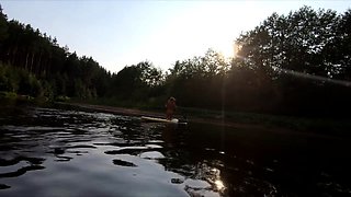 Tattooed Babe Strips and Swims on a SUP Board in the Forest