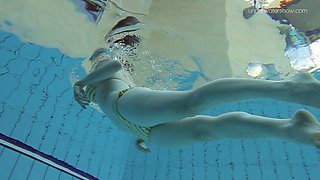 Gorgeous Lada Poleshuk slowly goes nude while swimming around