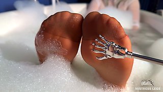 Scratching Mistress's Nylon Feet with a Scratcher in a Foam Bath