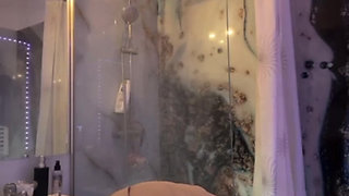 A whore slips into the toilet to use a remote-controlled dildo vibrator