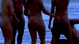 Big ass on the beach with several naked women having sex