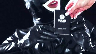 Latex suit male slave licking the feet of his mature mistress