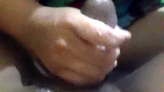 Sweet hand squeezing black cock