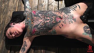 slender tattooed nympho gets railed by a dom stud's machine