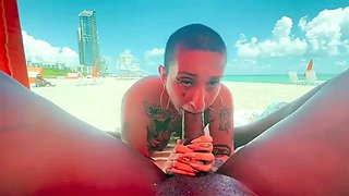 Cum loving tattooed MILF sucks off big black cock outdoors