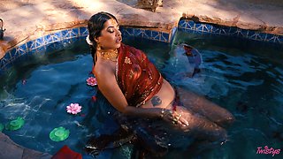 In the moonlit waters' embrace, Jasmine Sherni awakens sensual passions with graceful allure.