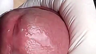 Glans Game with White Latex Gloves in Super-closeup. Alternative View.