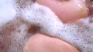 Busty curly brunette with big boobs fucks on couch