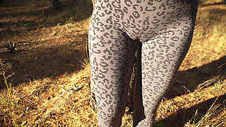 Girl Teases Her Big Cameltoe in Leopard Leggings Outdoors