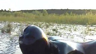 Outdoor solo masturbation scene with curly blonde