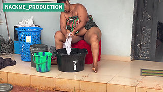 African Mama Multitasks on a Sunday Morning