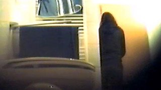Girl using the toilet and filmed by voyeur 2