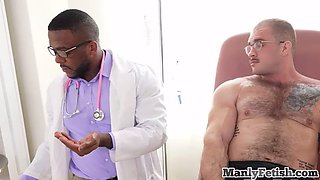 Muscled jock gets handjob by ebony doc