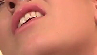 Two Hot Teens Kiss and Please Their Shaved Pussies with a Toy on the Couch