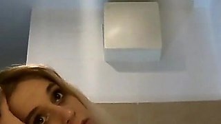 Cute and Hot Sexy Tight Pussy Cheerleader Shows Her Shaved and Wet Pussy Under Her Mini Skirt in the Bathroom