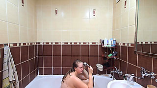 Pretty chubby wife with big natural tits takes a shower