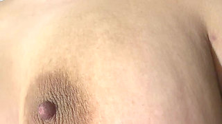 Mom massages her huge tits deliciously