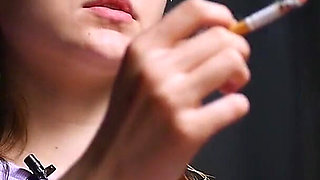 18 Aged Girl Is Smoking Two Strong Cork Cigarettes