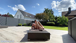 Hot milf pampers her sexy body on the terrace and oils herself