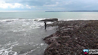 Rubbery Beach Encounter: Lucy's Neoprene Pussy Play with Stranger