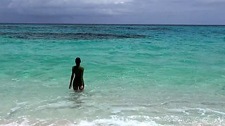 Brunette babe erotica herself on beach