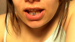 Giantess Girl Unwraps a Candy but Is Surprised Because There Is a Tiny Man in the Candy Bag - She Is Curious to See What It