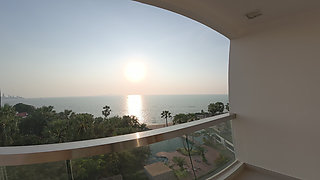 Cute Asian in Black Lace Lingerie Sways Hips on Oceanfront Balcony