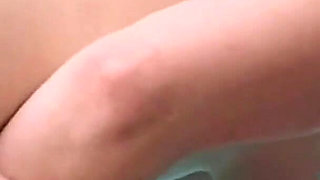 Curly-haired Babe Masturbates with Bottle in Hot Tub