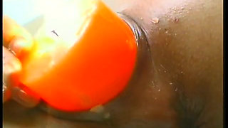 Brunette mature slut wearing stockings while drilling her holes with food and huge candle