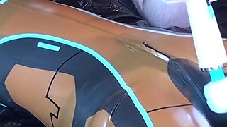 Latex Danielle is attached to the bed and masturbated with the massage vibrator