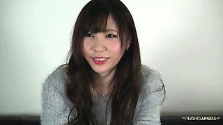 In order to enhance the modeling audition, the Asian woman engages in oral sex with the cameraman
