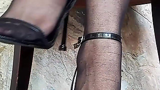 In Front of You the Secretary with Pantyhose and Stiletto Heels Dangling From Her Feet