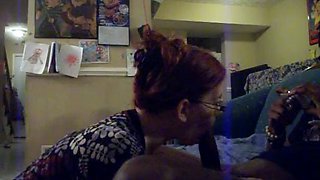 Redhead With Glasses And Big Tits Giving A Long Blowjob To