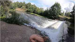 Girl Shows Pussy By A Waterfall