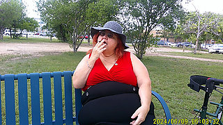 Nurse Vicki Smoking in the Park on a Bench All Dressed up